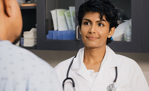 Friendly doctor with patient