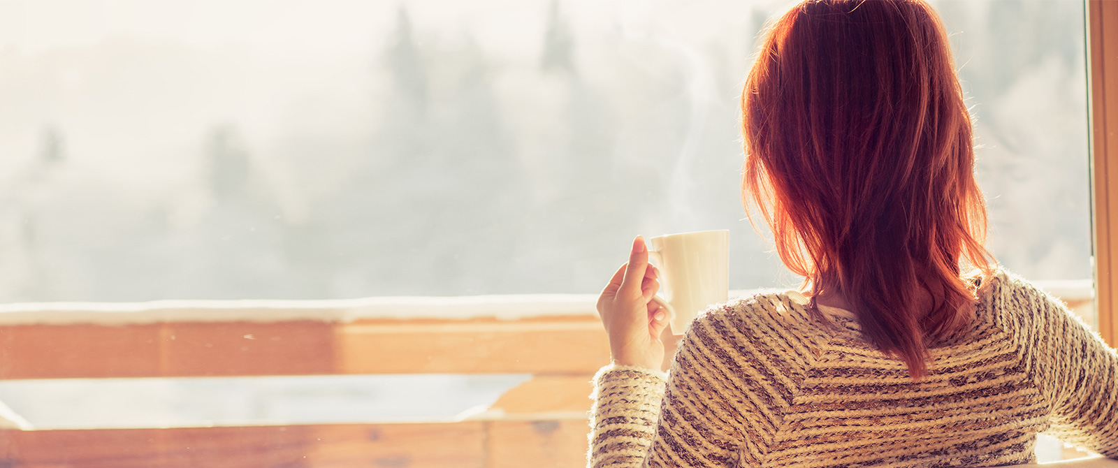 Woman looking out window