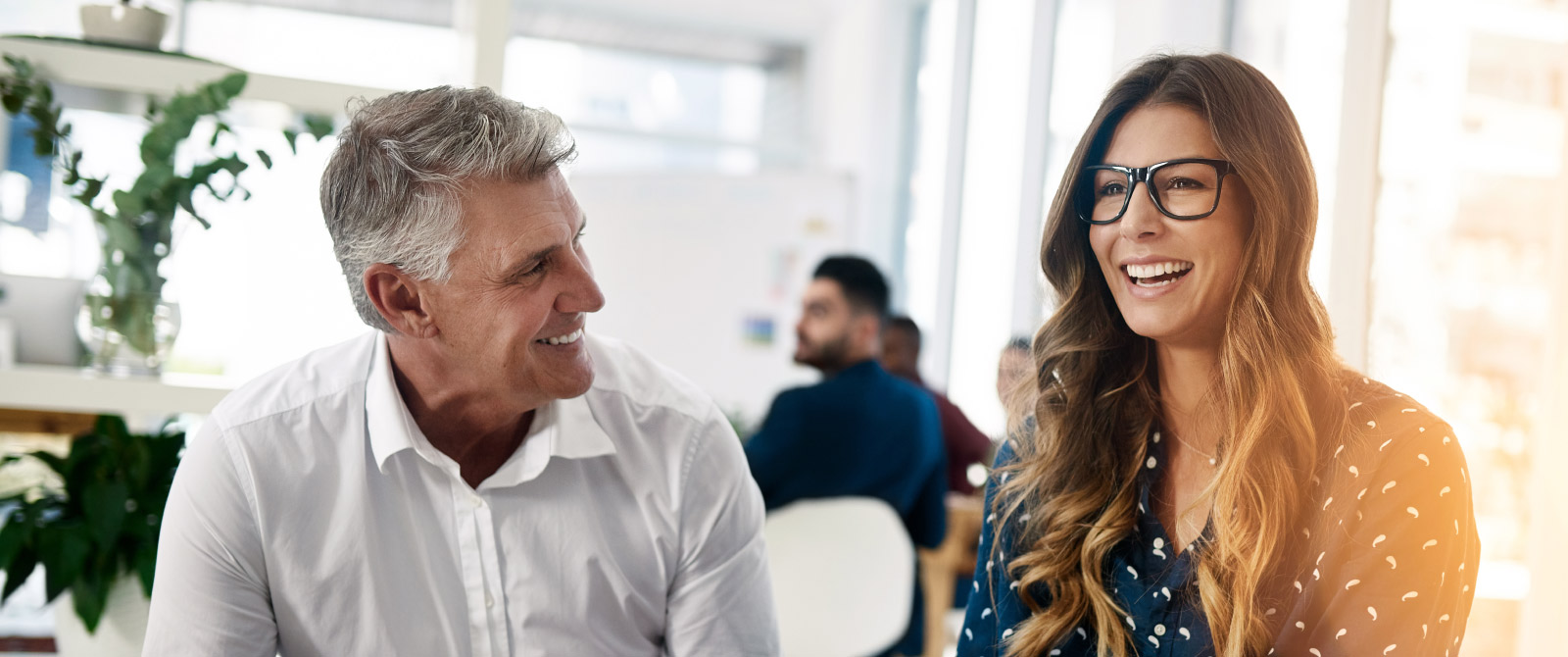 Business man and woman having light conversation.