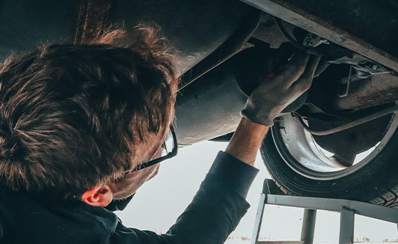 Mechanic working on vehicle