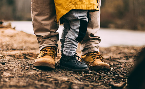 Parent and child standing together